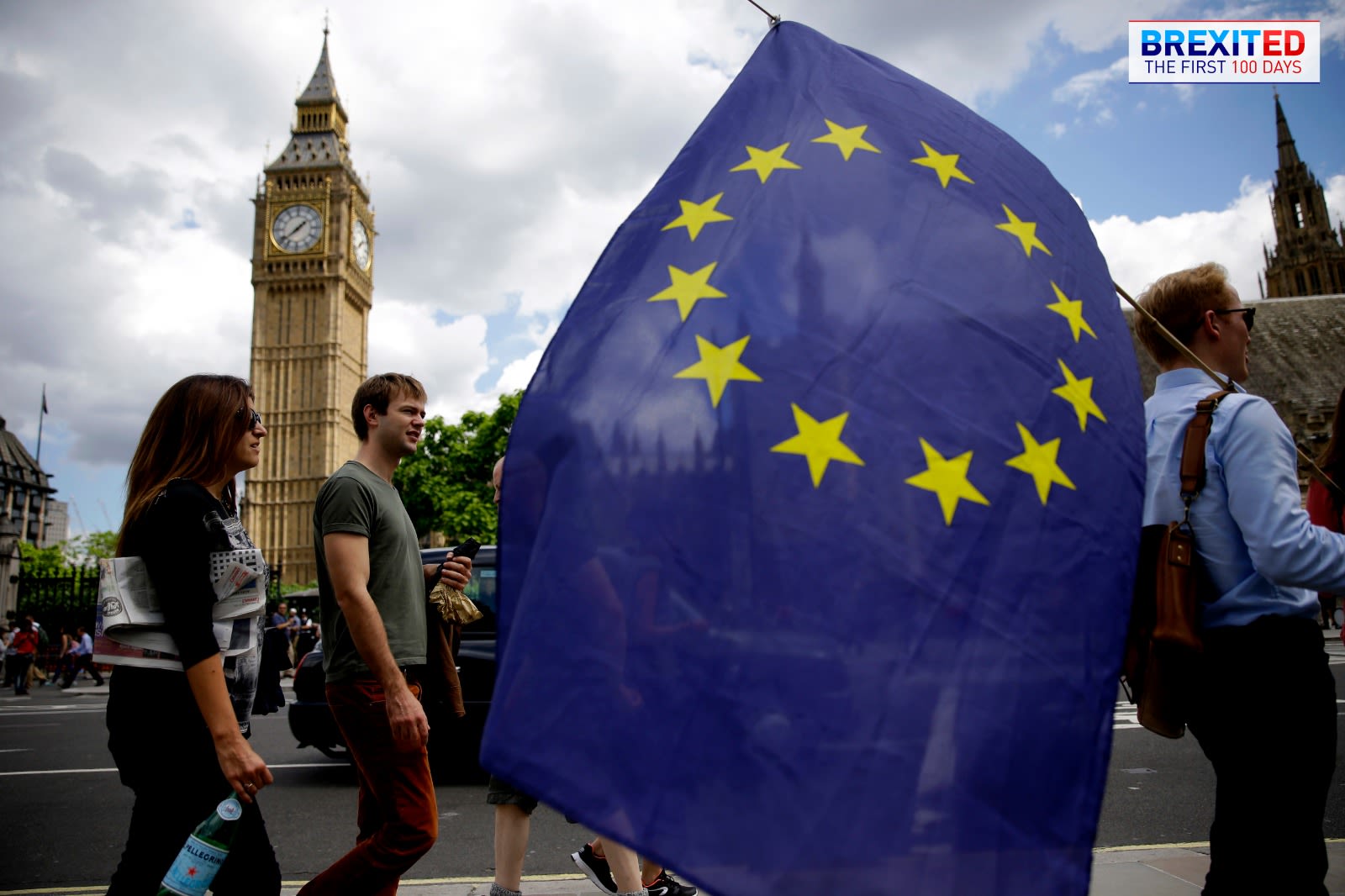 A European Union flag is held near Big Ben, London.