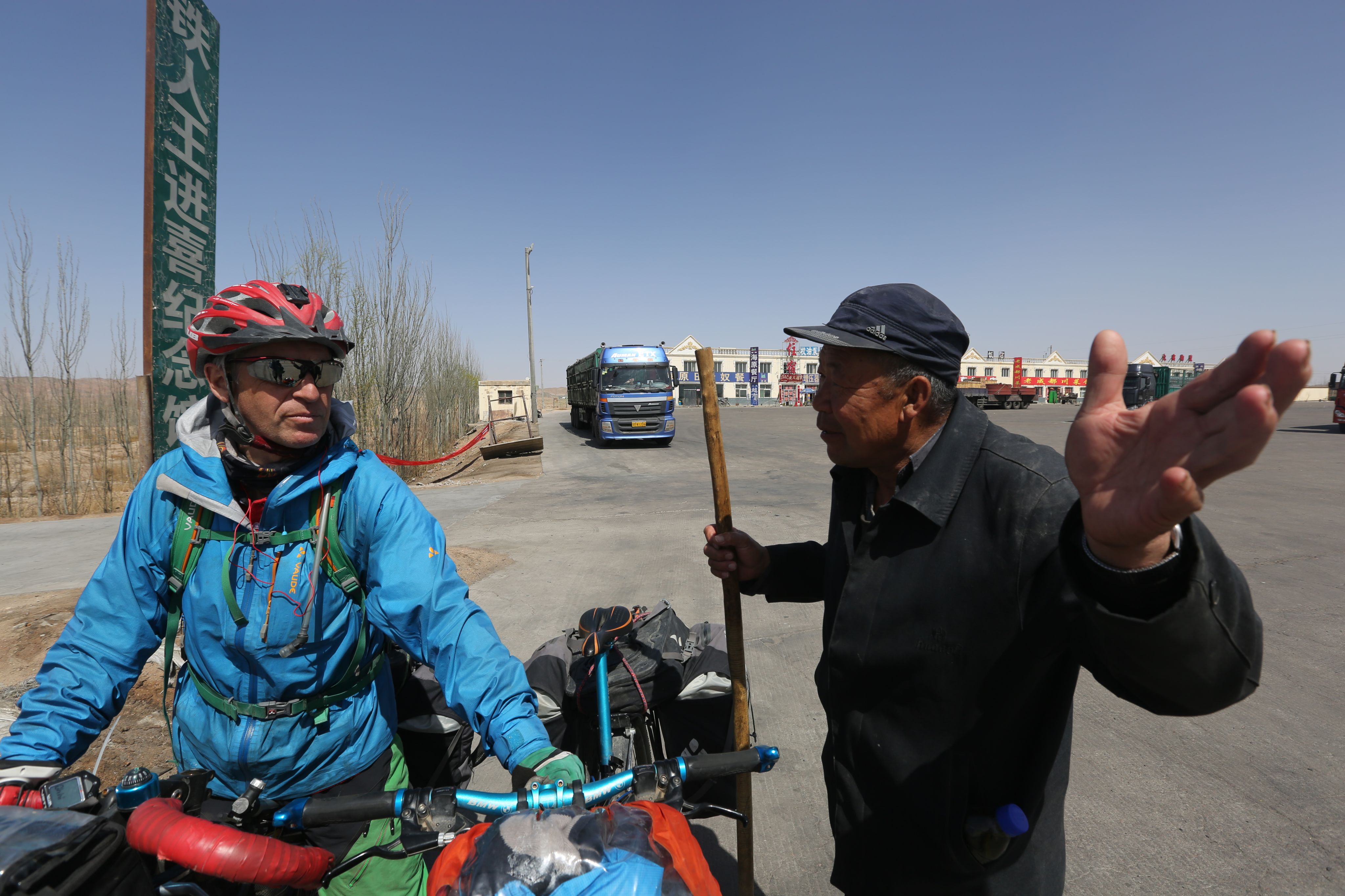 Grey and a sheep herder in Gansu during the 2014 trip.