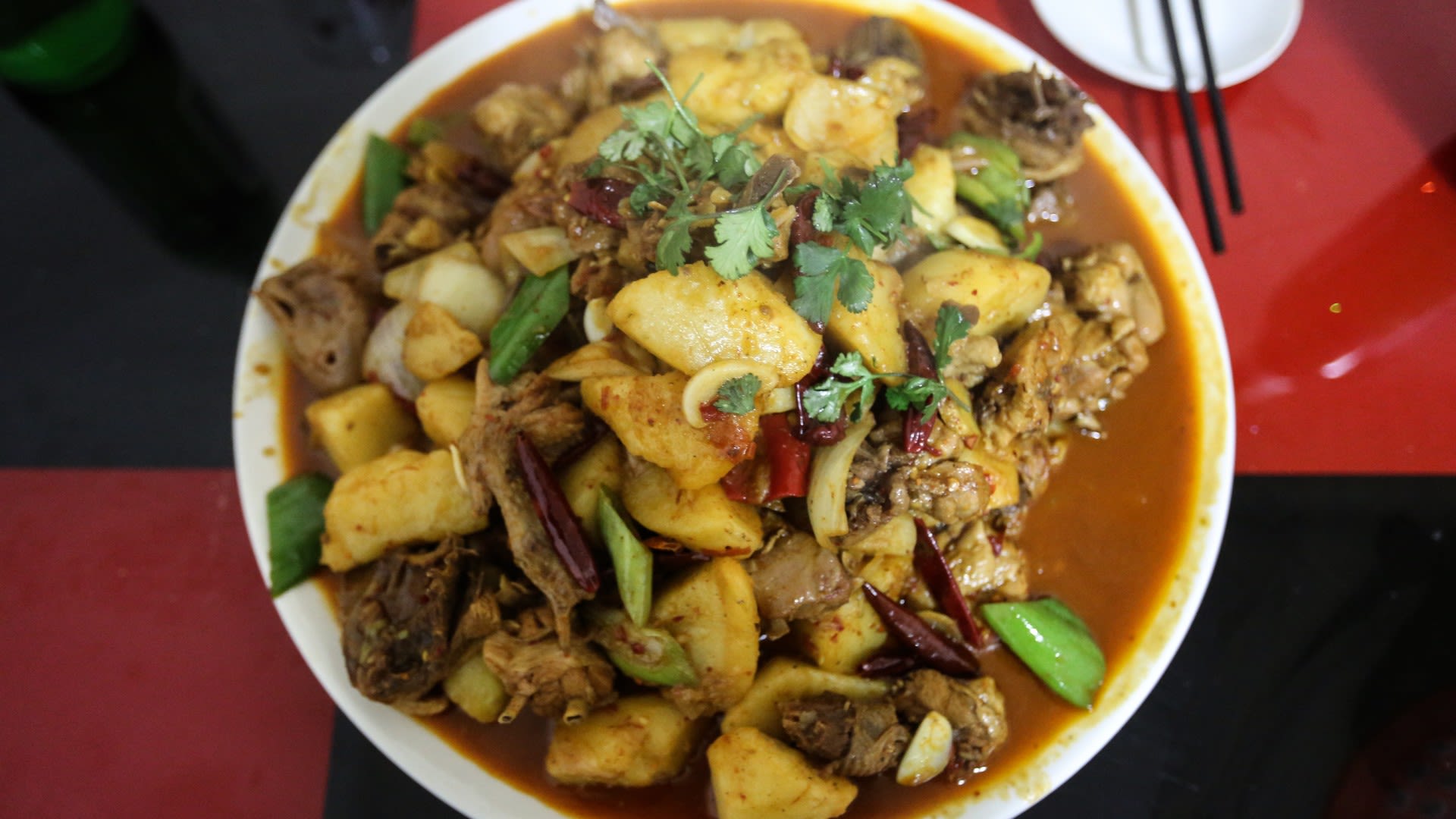 Grey's favorite food: dapenji, literally 'big plate of chicken,' a Xinjiang staple.
