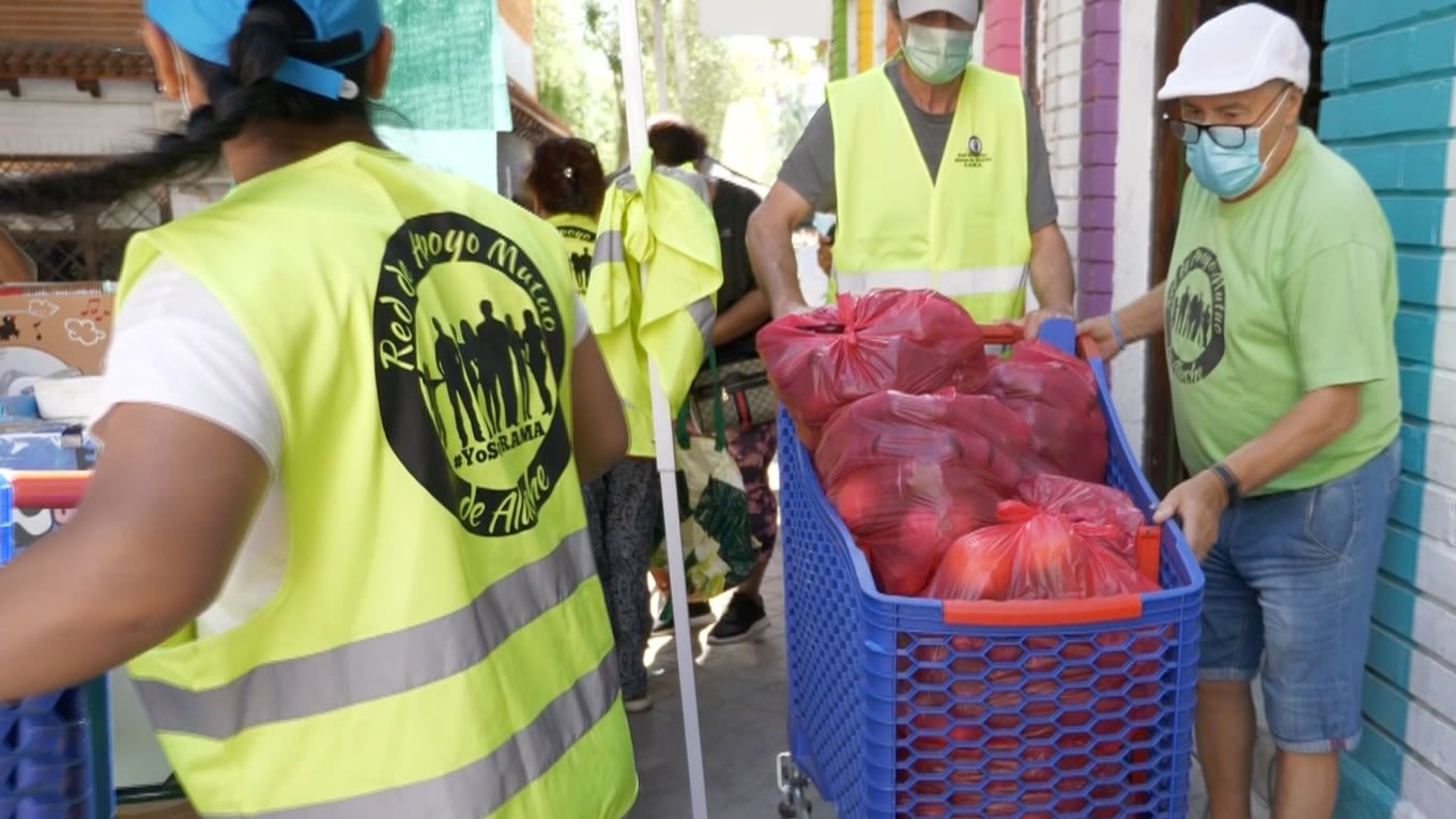 Voluntary workers distribute produce at a food bank in Madrid.