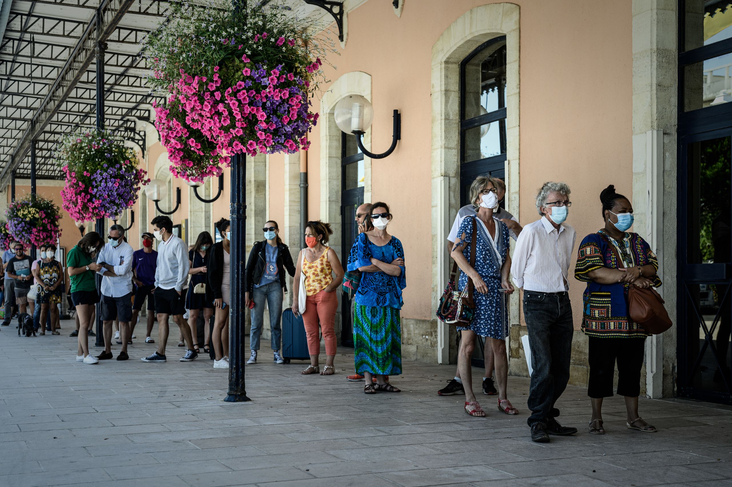 People queue for free COVID-19 testing outside Arcachon railway station in France.