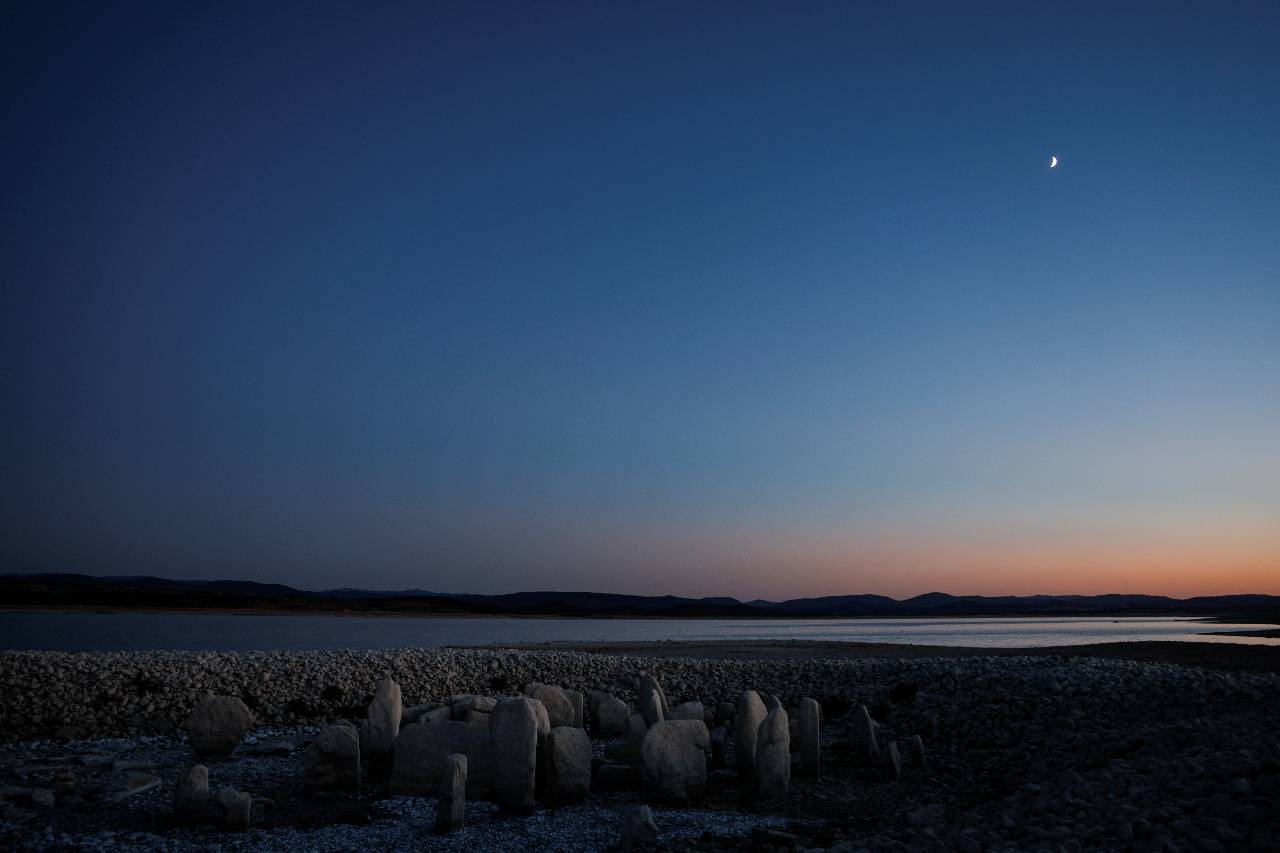 Spain's 'Stonehenge' emerges from the drying Valdecanas reservoir as a harbinger of climate crisis to come. /Susana Vera/Reuters